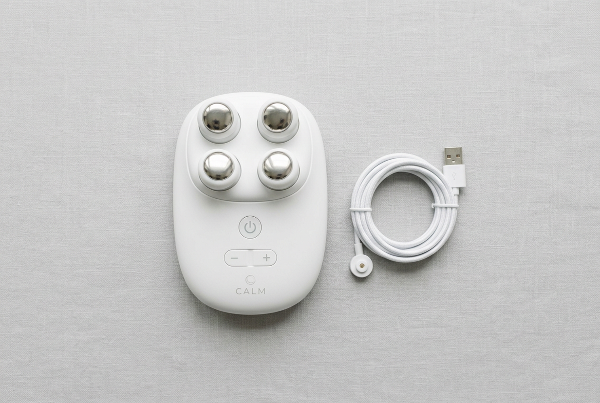 4-Head Cervical Neck Massager flat lay with USB charging cable